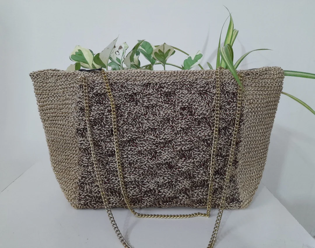 A two-tone crochet tote bag in warm and cool blocks.